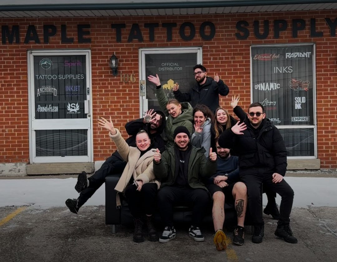 Maple Tattoo Supply team celebrating Family Day with a group photo in front of the store
