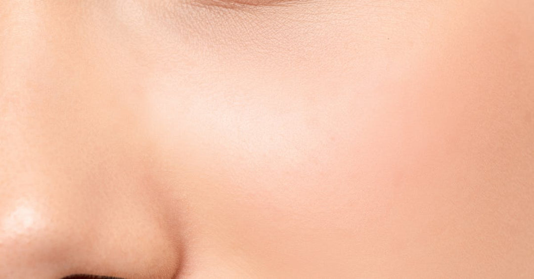 Close-up of eyelid and eyebrow area showing healed PMU eyeliner application