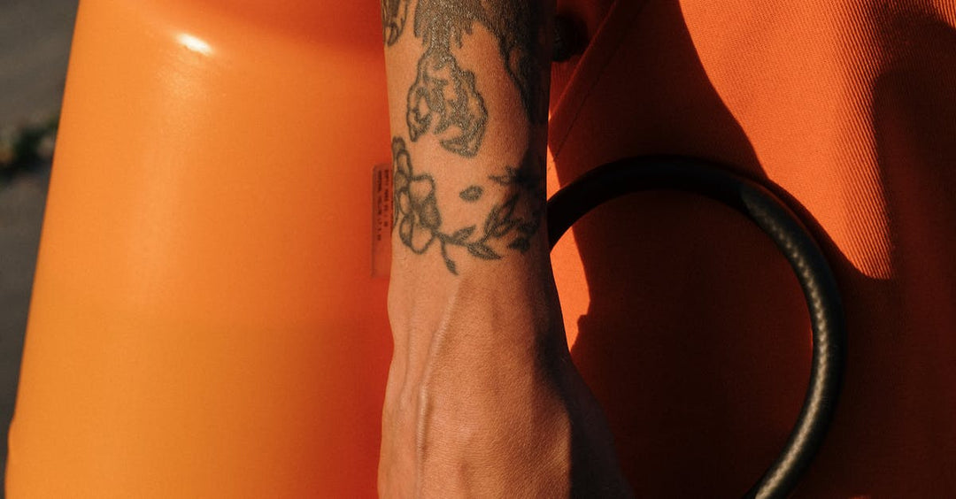 Tattoo artist preparing sanitation tools for safe equipment maintenance