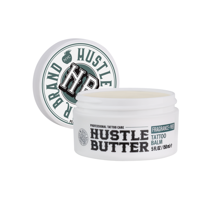 Hustle Butter Fragrance-Free Tattoo Balm 5oz jar with lid leaning behind