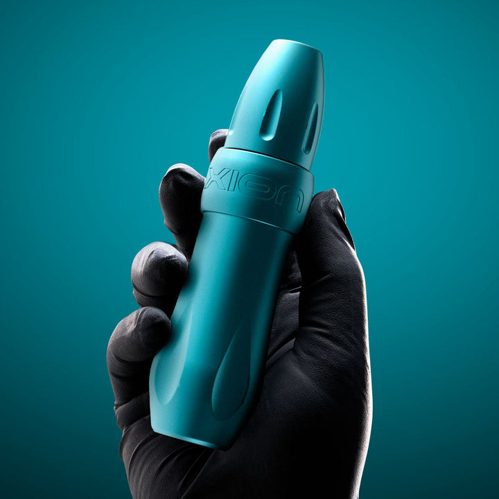 Spektra Xion Tidal modular tattoo machine held in artist's hand